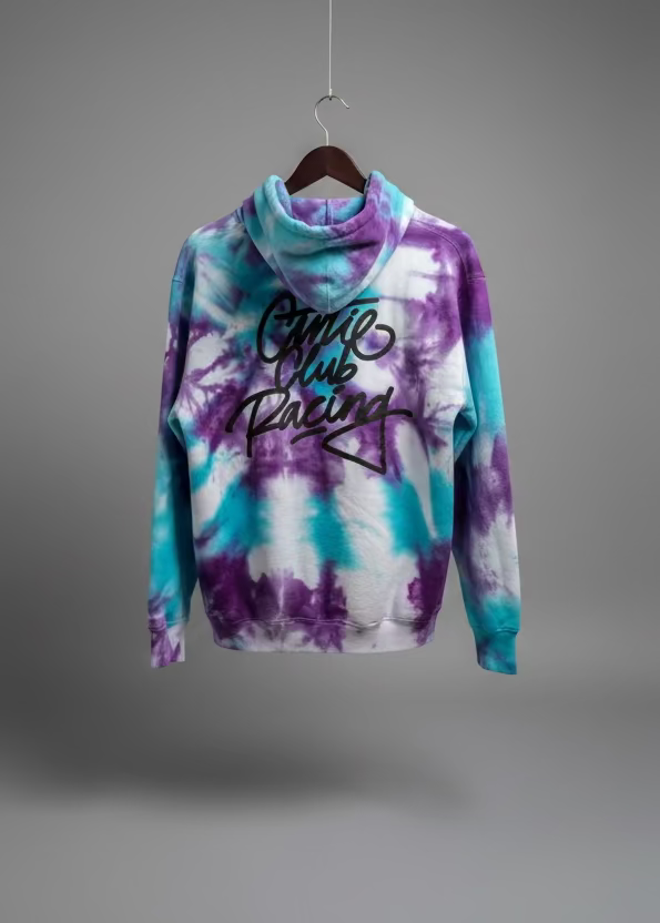 The back of a Tie-dye hoodie with text on the back,  in a bathroom.