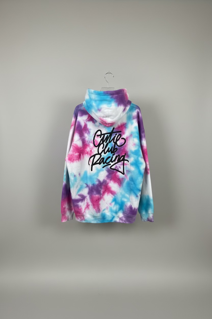 Tie-dye hoodie with 'Cute Club Racing' text in a bathroom setting