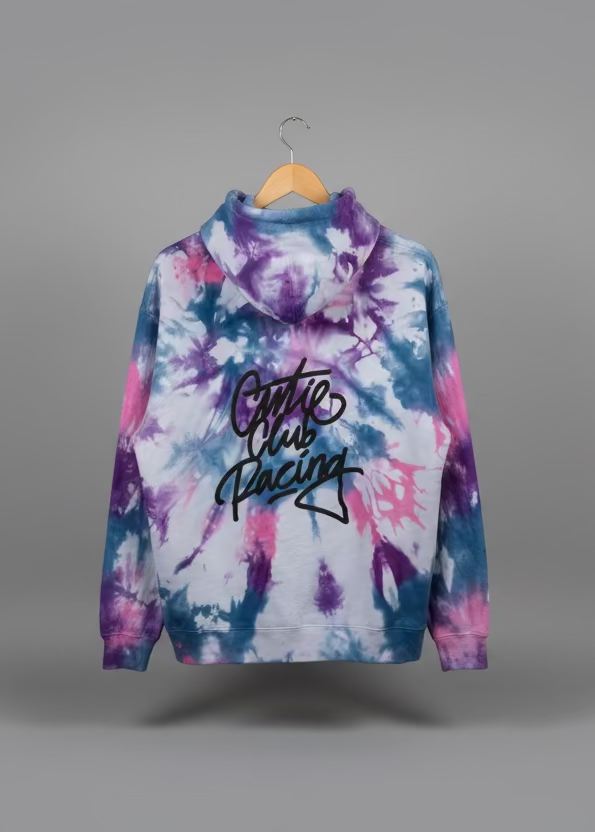 Tie-dye hoodie with 'Couture Racing' text on a mannequin against a neutral background
