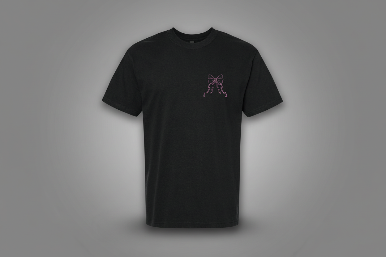 Black t-shirt with a small pink design on a white background